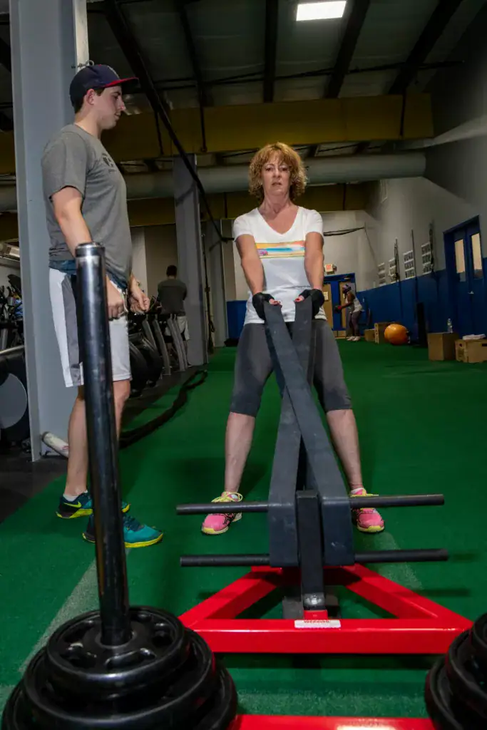 Personal trainer in Harrisburg PA working with client on sled