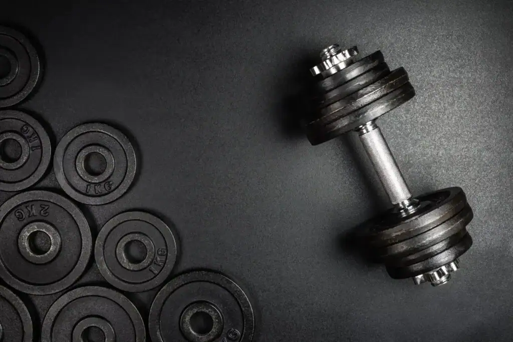 Dumbbells Next To A Bunch of Free Weights