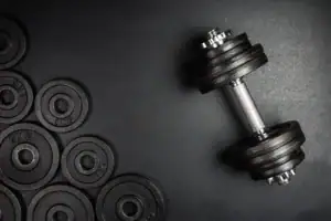 Dumbbells Next To A Bunch of Free Weights